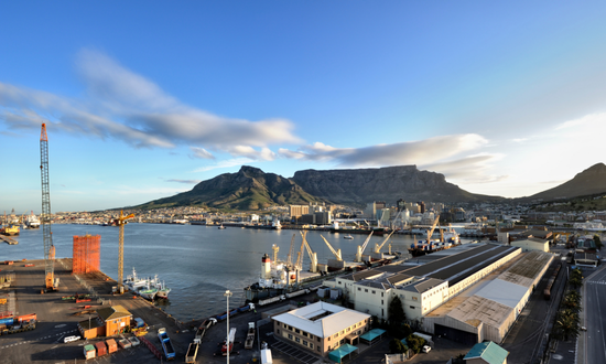 Shot of Table Mountain in the background with Cape Town harbour in the foreground.
