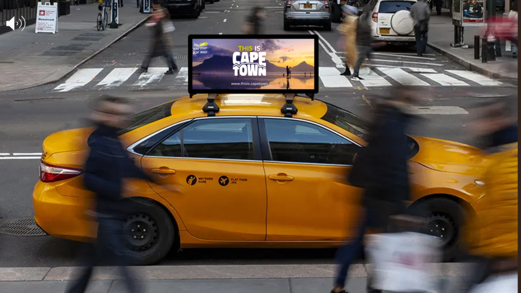 A yellow cab in New York with the This Is Cape Town branding.